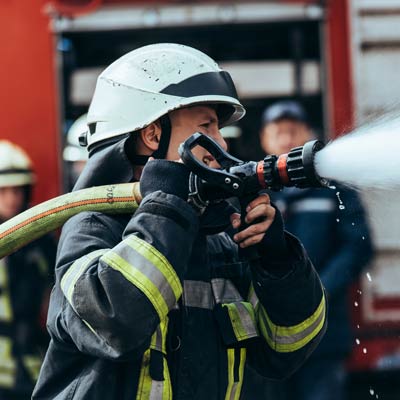 firefighter with water hose