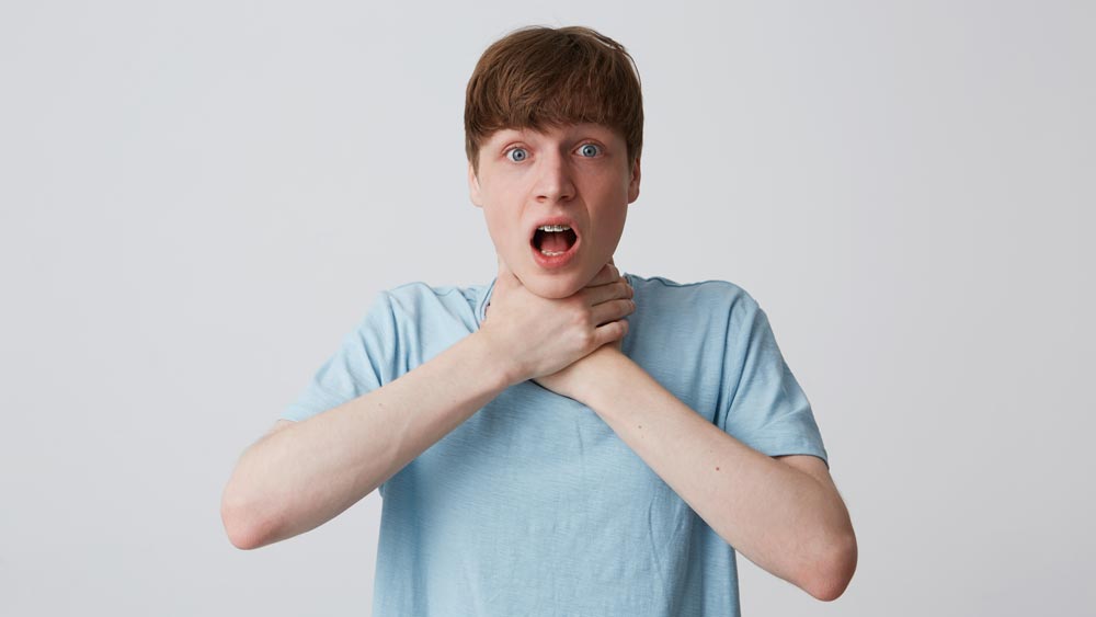 young man choking