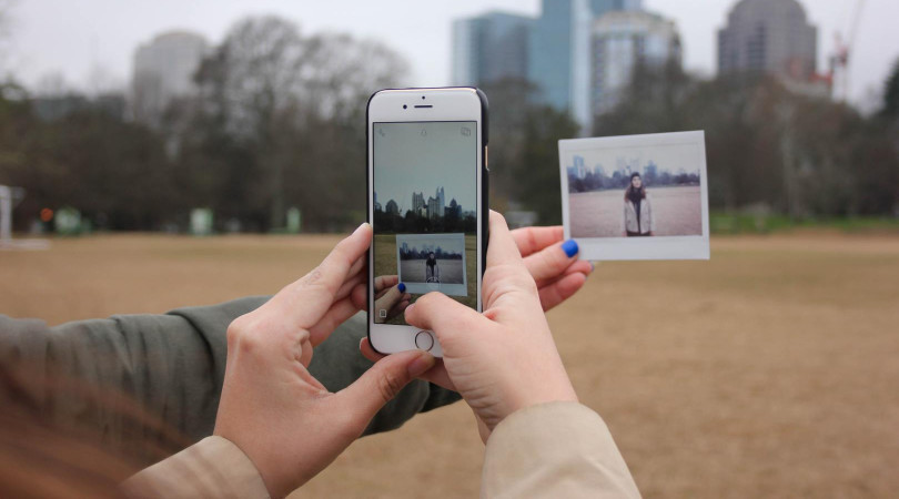 taking photo of polaroid with smartphone