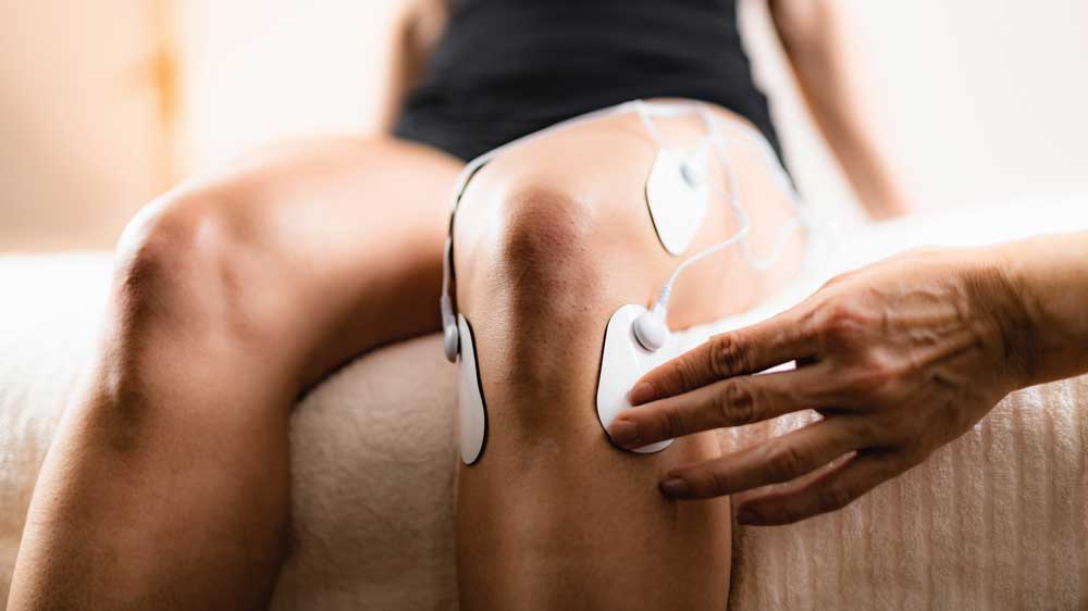 knee physical therapy with tens electrode pads