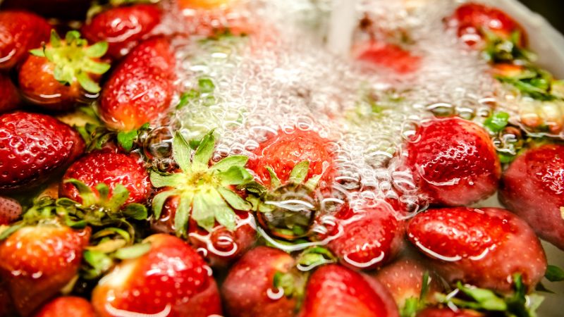 clean strawberries in cold water