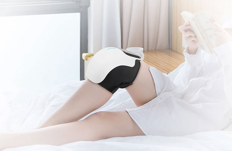 nooro knee massager bed-reading book